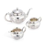 A CHINESE SILVER THREE-PIECE TEA SERVICE