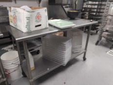 Stainless steel table and contents with plastic bins