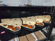 four violins with box
