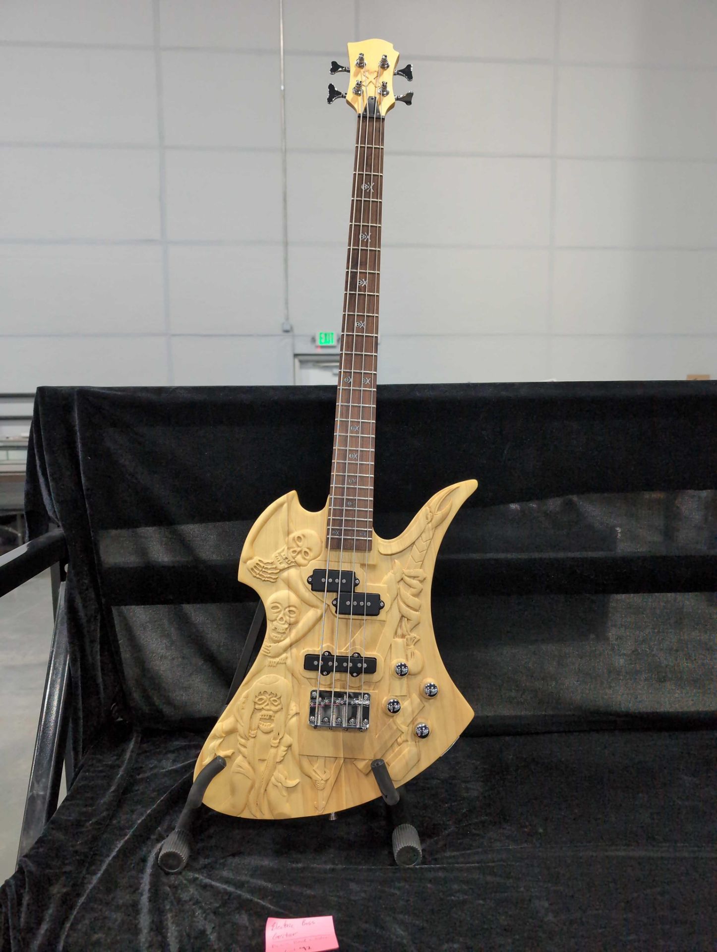 electric bass guitar with custom skull carvings