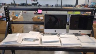 Apple MacBooks and iMacs appear used