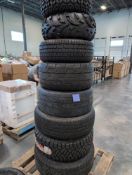 pallet of large tires with rims and wheels