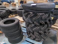 smaller go-kart tires, three large off-road tires and a few miscellaneous motorcycle tires