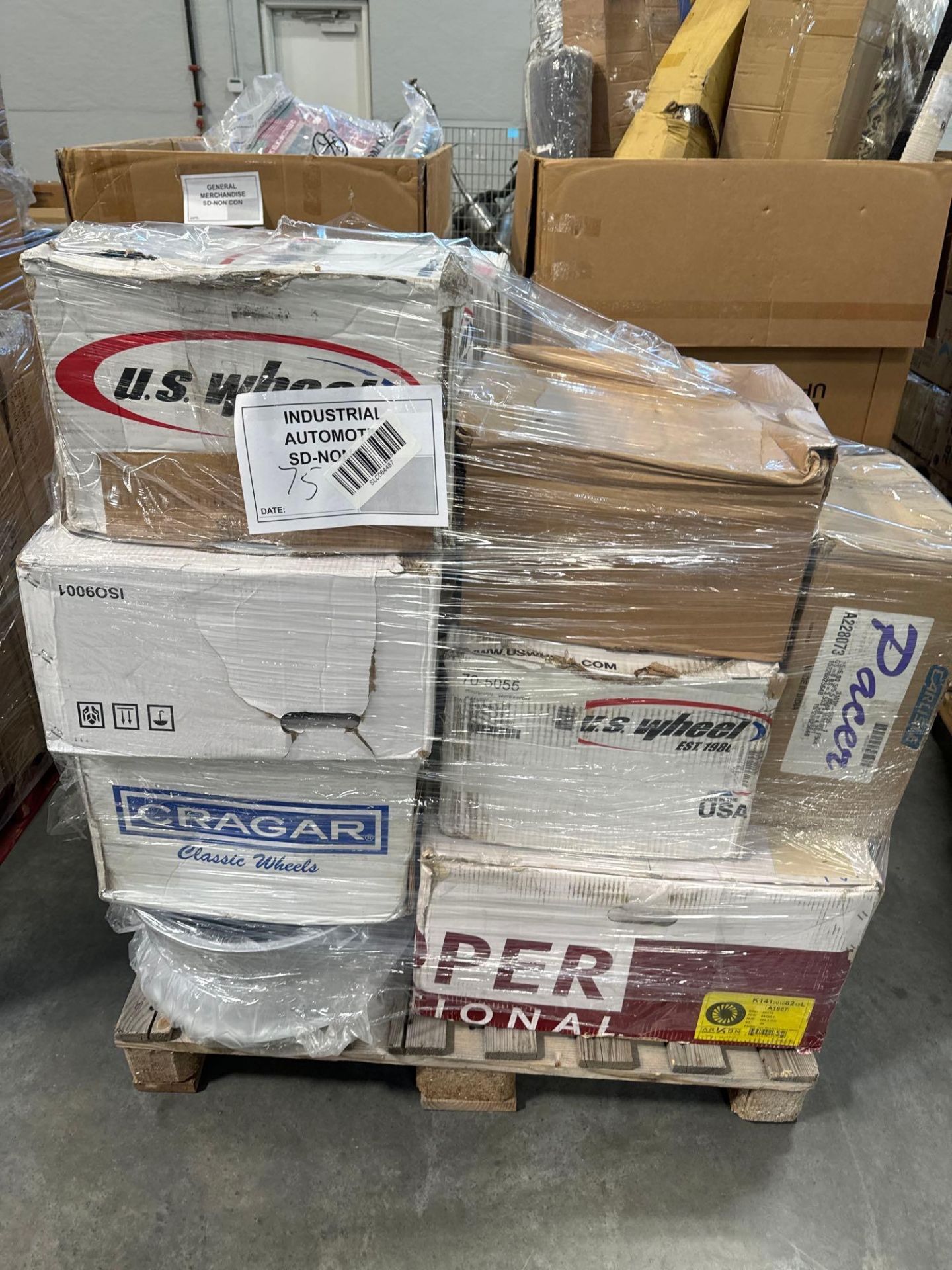 pallet of rims and wheels