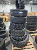 pallet of large off-road tires and tractor tires