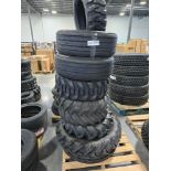 pallet of large off-road tires and tractor tires