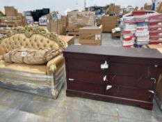 brown dresser and large gold sofa