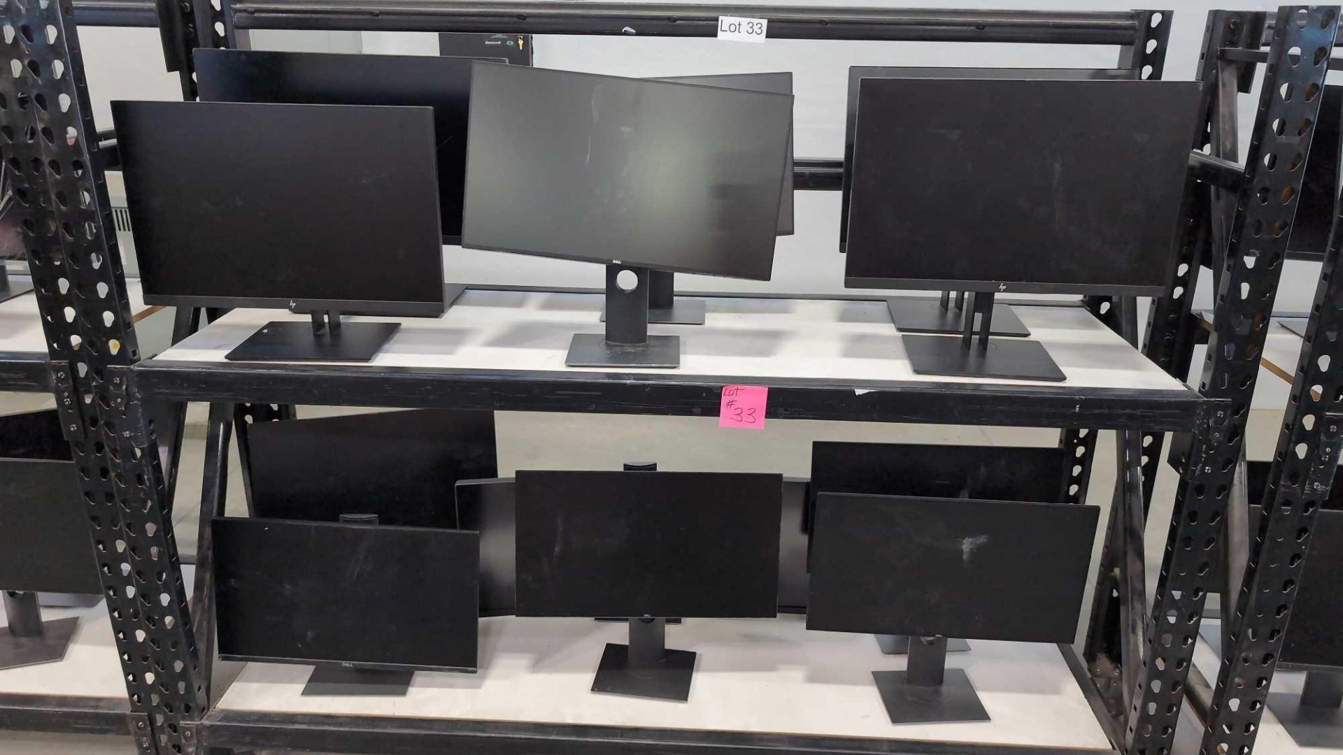 12 Dell Computer Monitors, one curved