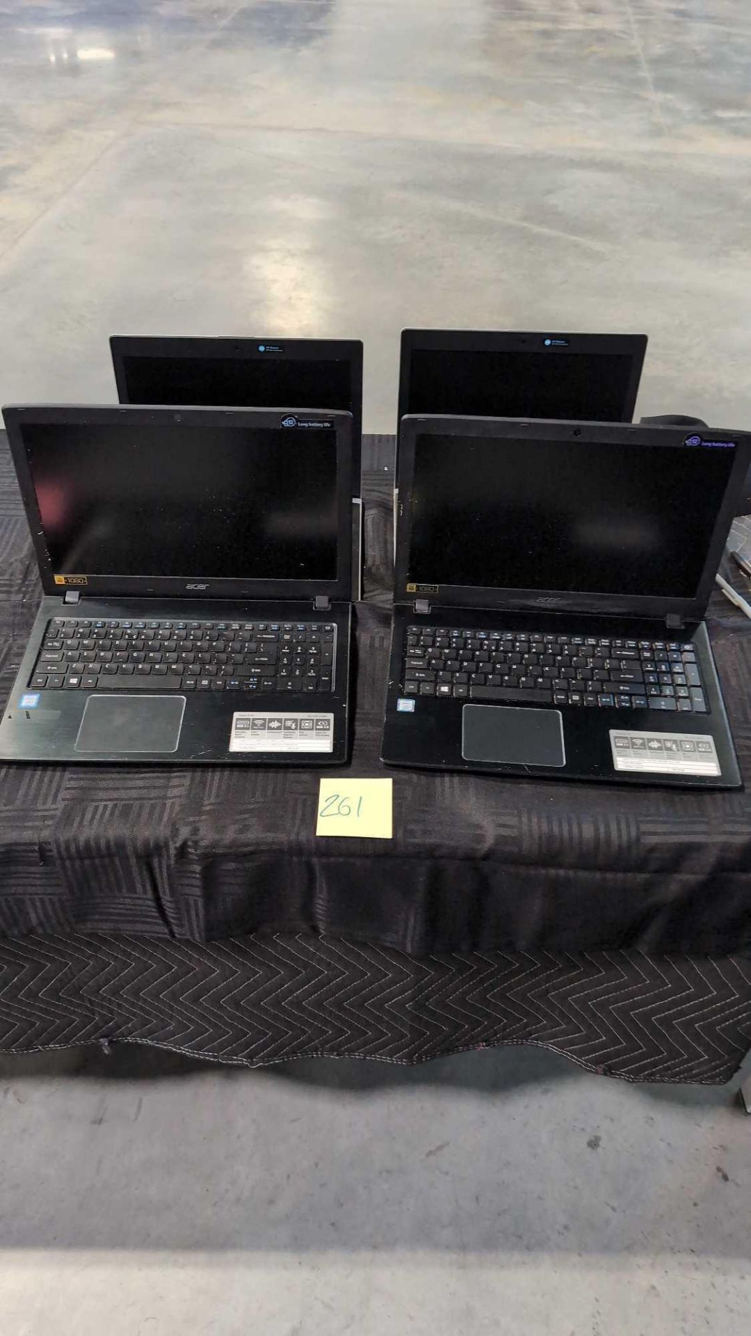 four laptops, two HP and two Acer