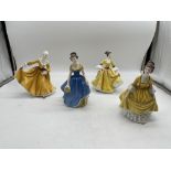Yellow Royal Doulton ceramic figurines