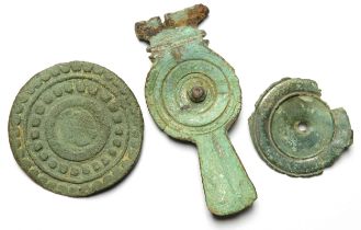 Roman Brooch Group. Circa 2nd-4th century CE. To including, a rosette brooch and two disc