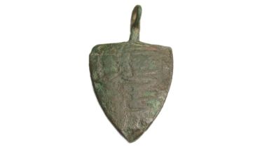 Medieval Heraldic Harness Pendant. Circa 13th century CE. Copper-alloy, 11.58g. 45x26mm. A shield-