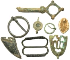 Medieval artefact group including a large key, two scabbard chapes, three buckles and a lead seal