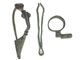 Roman Artefacts (3). Circa 2nd-3rd century AD. To include a complete brooch, a pair of cosmetic