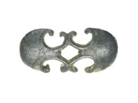 Roman Military Mount. Circa 2nd century AD. Copper-alloy, 8.91g. 42mm. A double pelta shaped belt