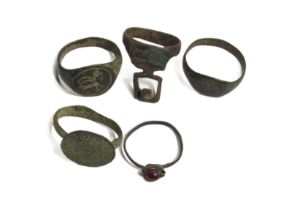 Ancient Bronze Ring Group (5). Circa 3rd-16th century AD. 22-24mm. To include, two Roman signet