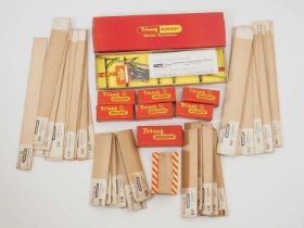 A large quantity of boxed / packeted TRIANG catenary sets and accessories - contents unchecked but