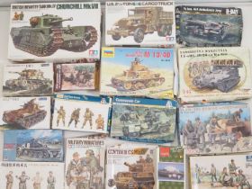 A group of unbuilt plastic military vehicle kits in various scales by TAMIYA, ITALERI and others -