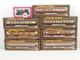 A quantity of OO gauge model railway rolling stock comprising: a DAPOL Class J94 steam loco and