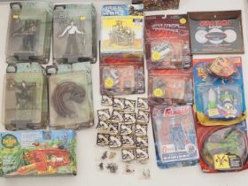 A large quantity of action figures and other toy items including Star Trek, The Matrix and others by