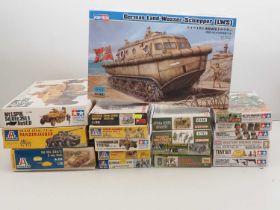 A group of unbuilt plastic military vehicle and figure kits in various scales by TAMIYA, DRAGON,