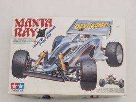 A TAMIYA radio controlled 'Manta Ray' off road racing buggy complete with controller - VG in G box