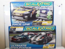 A pair of modern SCALEXTRIC sets comprising an Ultimate Endurance set (appears near complete but