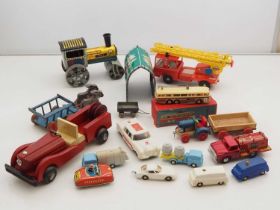 A group of mostly Eastern European vintage plastic, tinplate and wooden vehicle toys by various