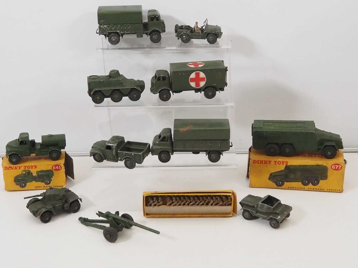A group of boxed and unboxed DINKY military vehicles and figures - F/G in P/F boxes (where boxed) (