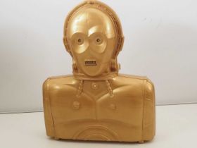 A 1990s STAR WARS miniature figure case in the style of C-3PO - battery operated talking version -