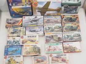 A group of unbuilt plastic military vehicle kits in various scales by AIRFIX, MATCHBOX and
