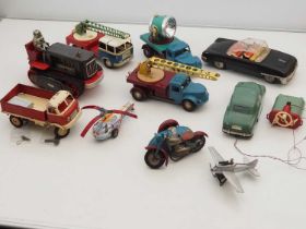 A group of vintage tinplate clockwork and battery operated vehicles - mostly Eastern European but