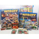 A pair of CORGI Auto City play sets together with a crate of assorted diecast boxed cars by CORGI