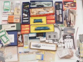 A large removals box containing a quantity of OO gauge accessories, part complete kits, buildings