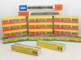 A group of HO gauge German Outline bogie passenger coaches by PIKO and SCHICHT all in DR