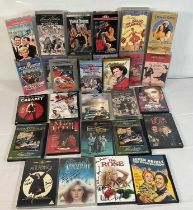 A collection of autographed Musical VHS tapes and DVDs including YANKEE DOODLE DANDY (1943) signed