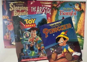 A collection of WALT DISNEY / PIXAR video release posters including TOY STORY (1995), BAMBI (
