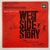 A copy of WEST SIDE STORY soundtrack vinyl record autographed by Director ROBERT WISE, Actors GEORGE