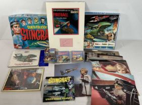 A collection of Gerry Anderson memorabilia including Stingray The Game, A Thunderbirds puzzle, a