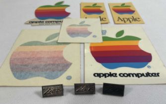 APPLE COMPUTERS - A group of Apple collectibles to include 3 1980s Apple 'Lisa' silver metal pin