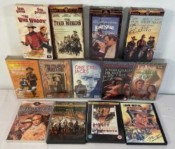 A collection of autographed Western movie VHS tapes and DVDs including THE MAGNIFICENT SEVEN (