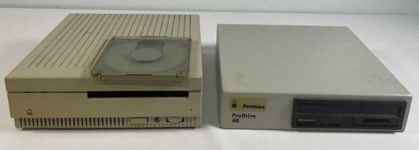 APPLE COMPUTERS - A 1988 Apple CD SC external CD-ROM drive with disk caddy, rainbow Apple logo,