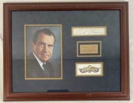 AUTOGRAPHS - A RICHARD NIXON signed postcard, presented in a display frame with a photographic still