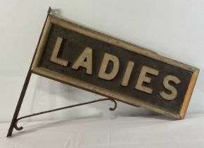 RAILWAYANA - An early 20th century, wooden, double-sided railway station ladies toilet sign with a