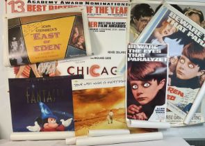 A collection of autographed original and reproduction movie posters of various sizes including