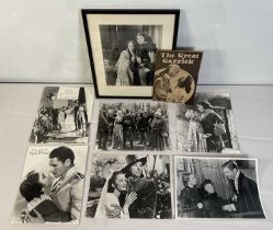 A group of 9 autographed promotional stills signed by OLIVIA DE HAVILLAND from the movies THE