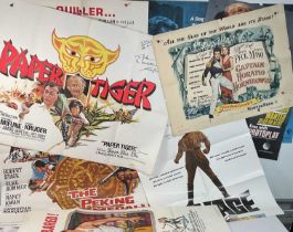 A group of autographed and unsigned Action / Thriller movie posters including JUNGLE FIGHTERS (1961)