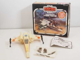 A vintage Star Wars (Empire Strikes Back) Battle Damaged X-Wing Fighter, with instructions and