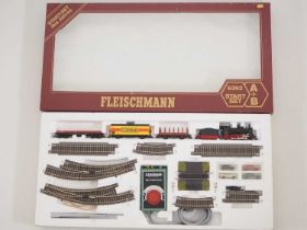 A FLEISCHMANN HO gauge starter goods train set, appears complete - VG/E in VG box