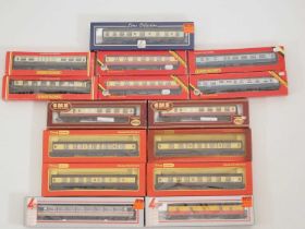 A large quantity of boxed OO gauge passenger coaches by HORNBY, LIMA and others in various